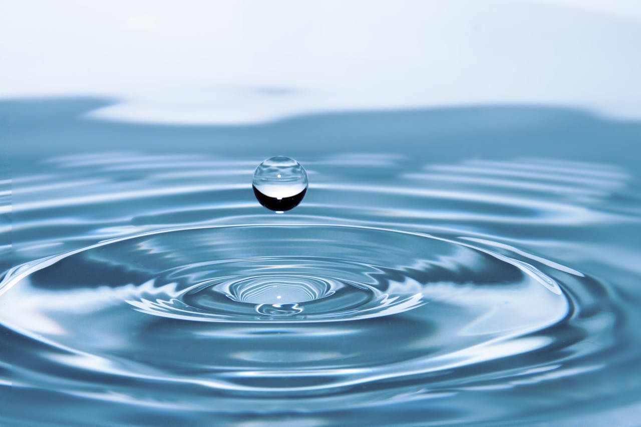 About A mesmerizing shot of a water droplet capturing the beauty of liquid dynamics.